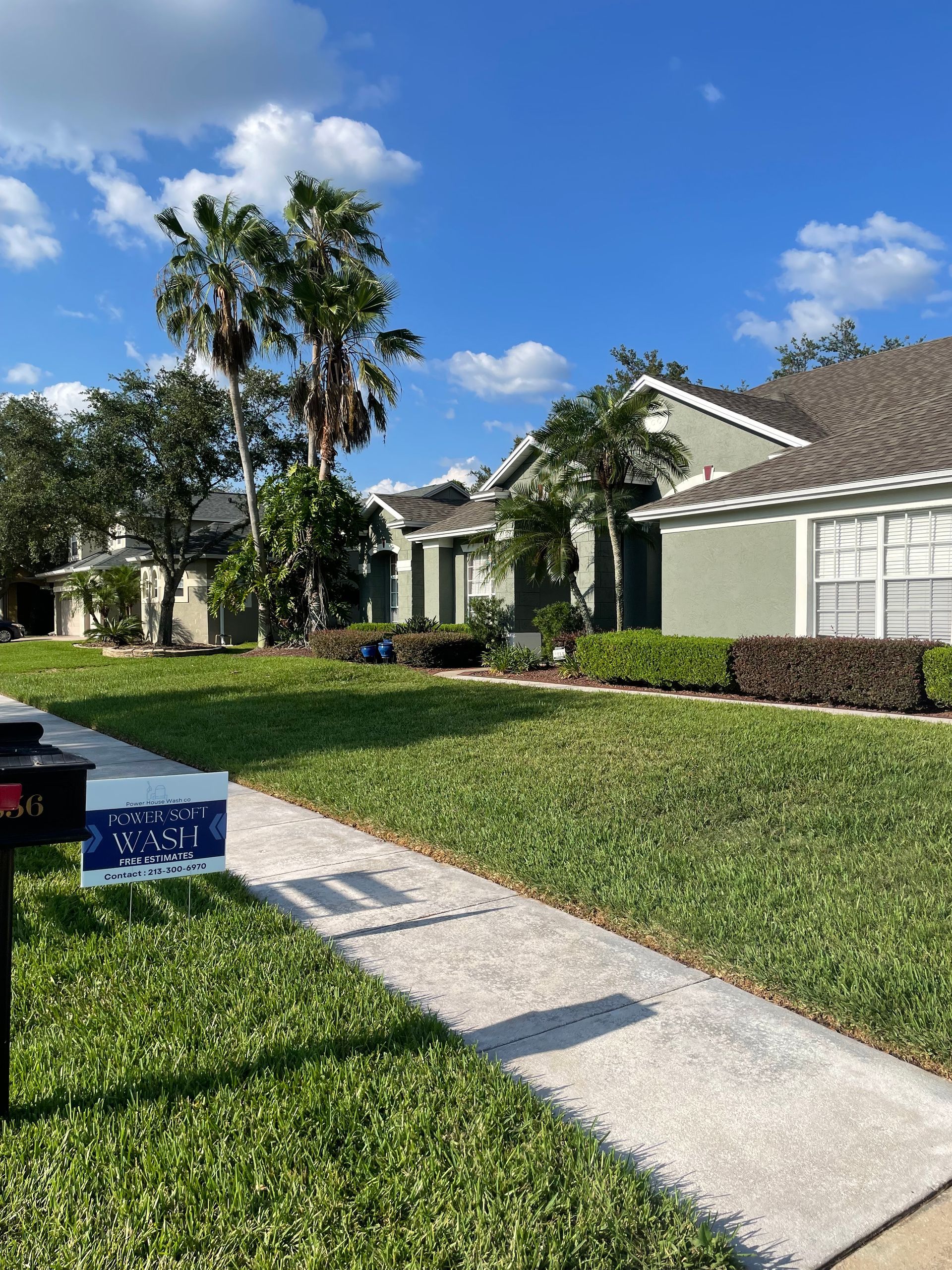 Nice sidewalk with sign on grass — Orlando, FL — Power House Wash