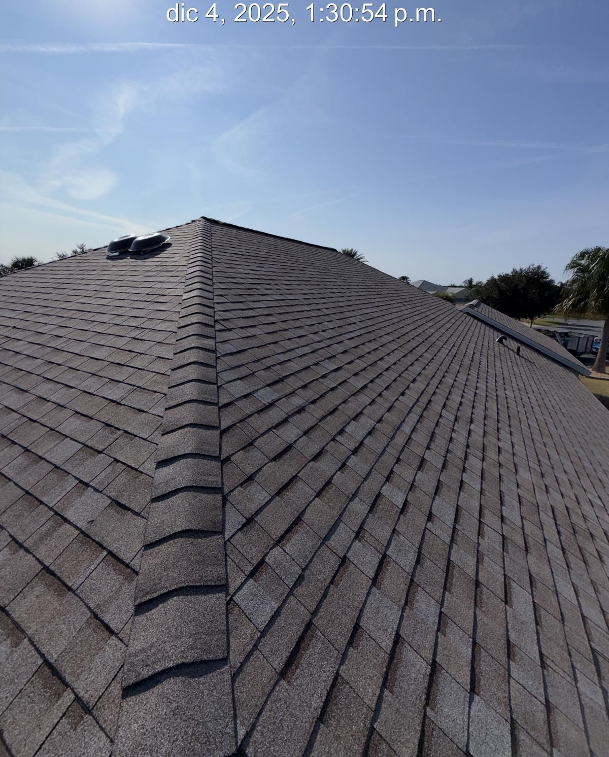 Asphalt shingle roof in Florida with ridge vent installed, supporting attic ventilation and moisture control
