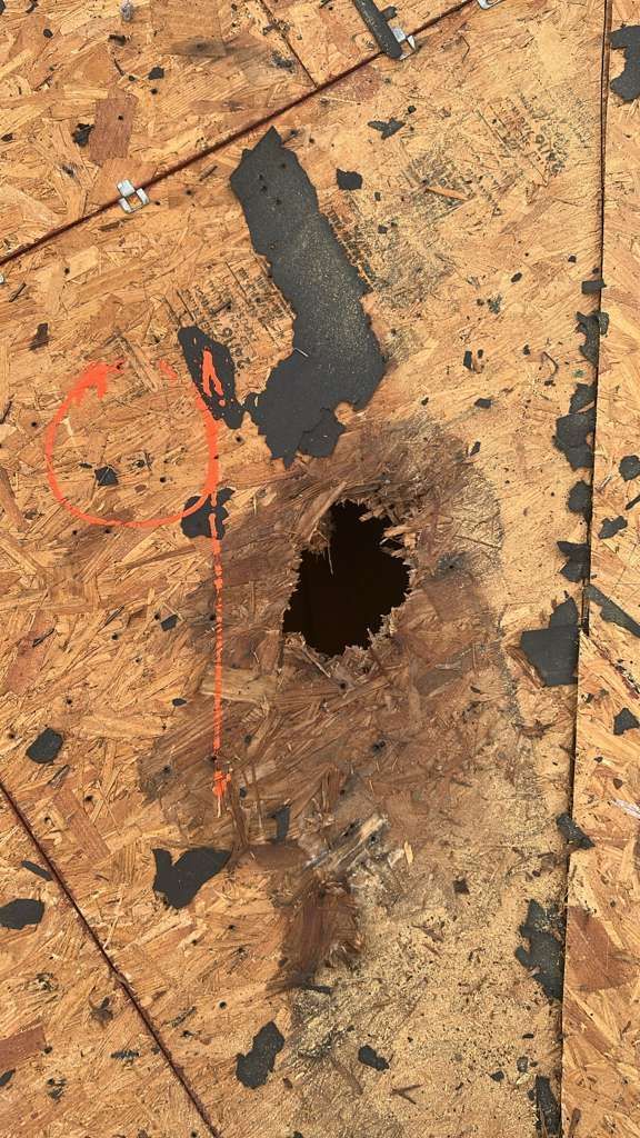 Roofing team repairing asphalt shingle roof on a home in Lakeland, Florida, demonstrating professional residential roof repair and safety standards.