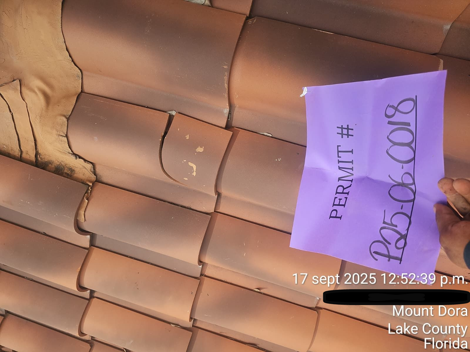 Roofing crew repairing clay tile roof in Orlando FL after storm damage — expert residential tile repair service.