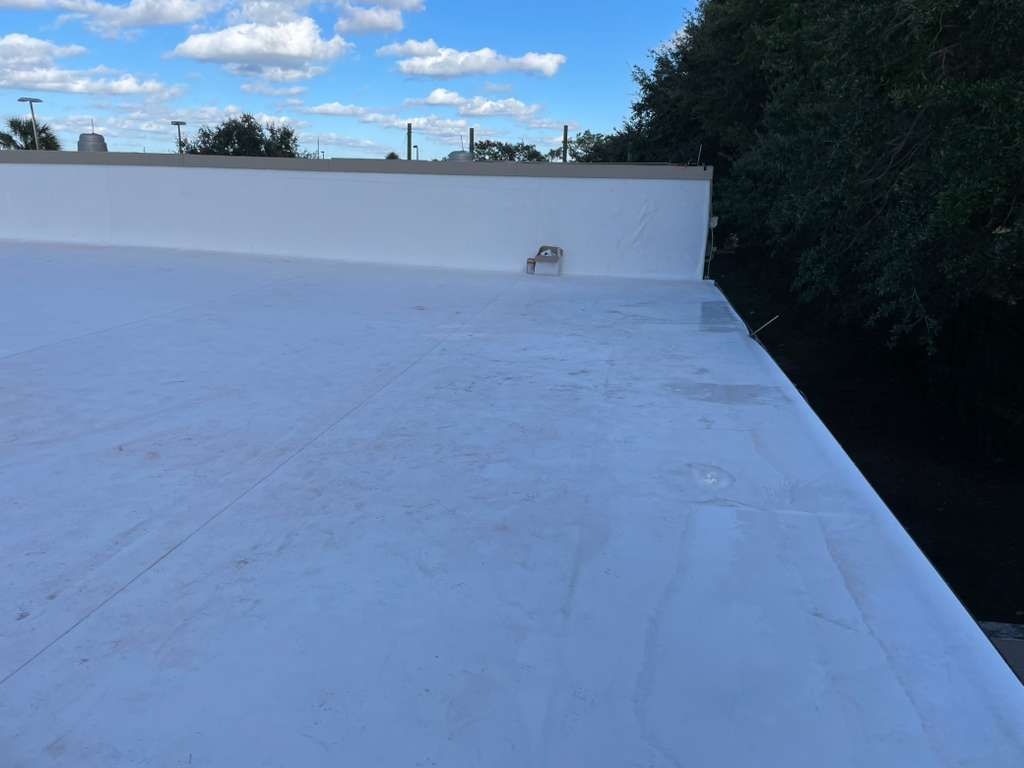 TPO flat roof in Orlando Florida recently installed, providing reflective waterproof protection for energy efficiency.