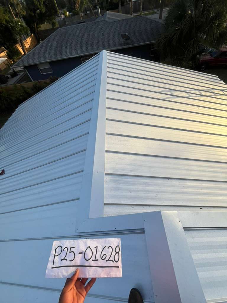 Standing seam metal roof installation in Kissimmee, Osceola County, Florida, engineered for 160+ mph wind resistance with concealed fasteners and long-term hurricane durability.