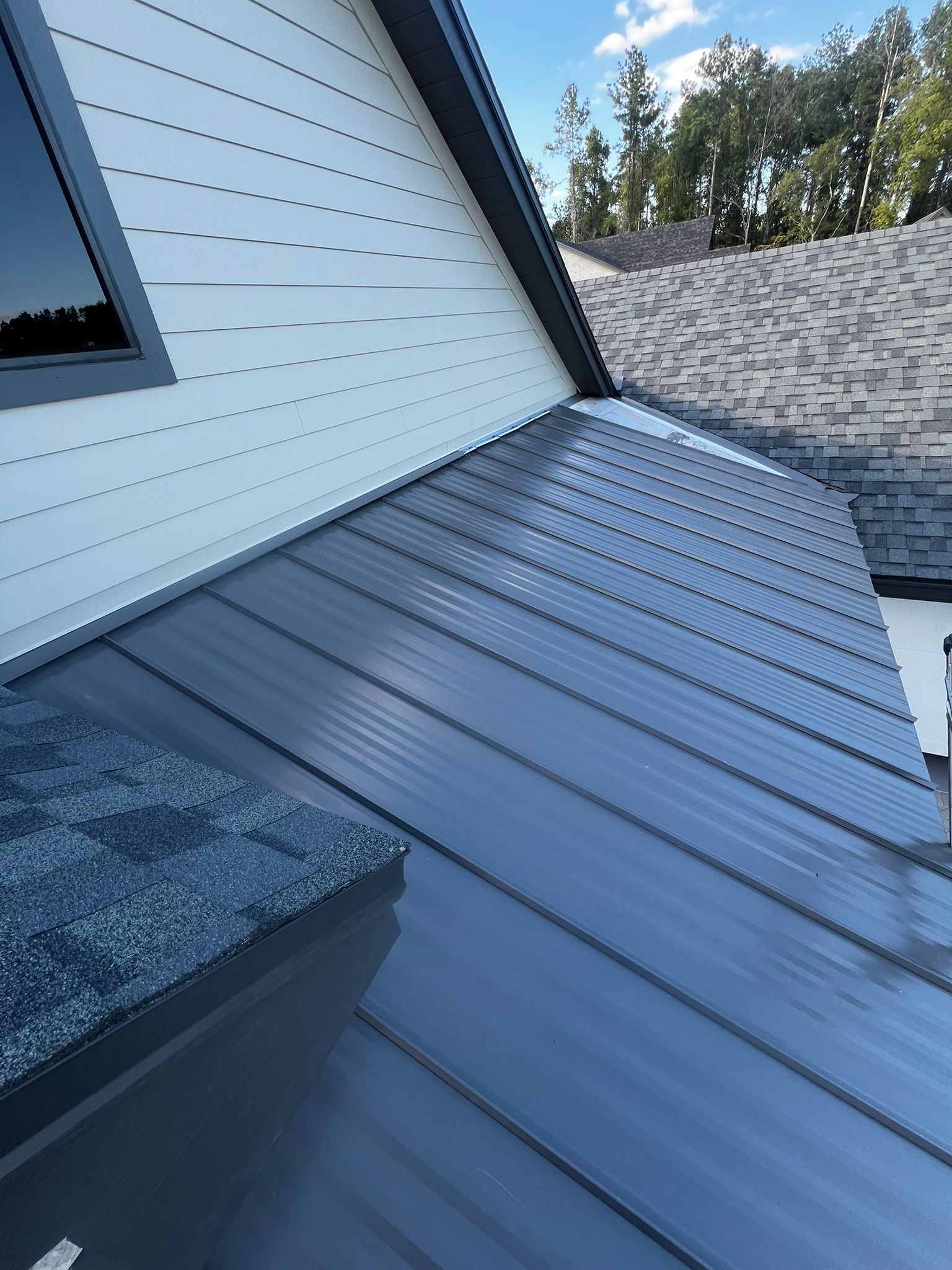 Metal roof repair on a residential home in Haines City, FL, performed by a local roofing company specializing in durable metal roofing solutions.