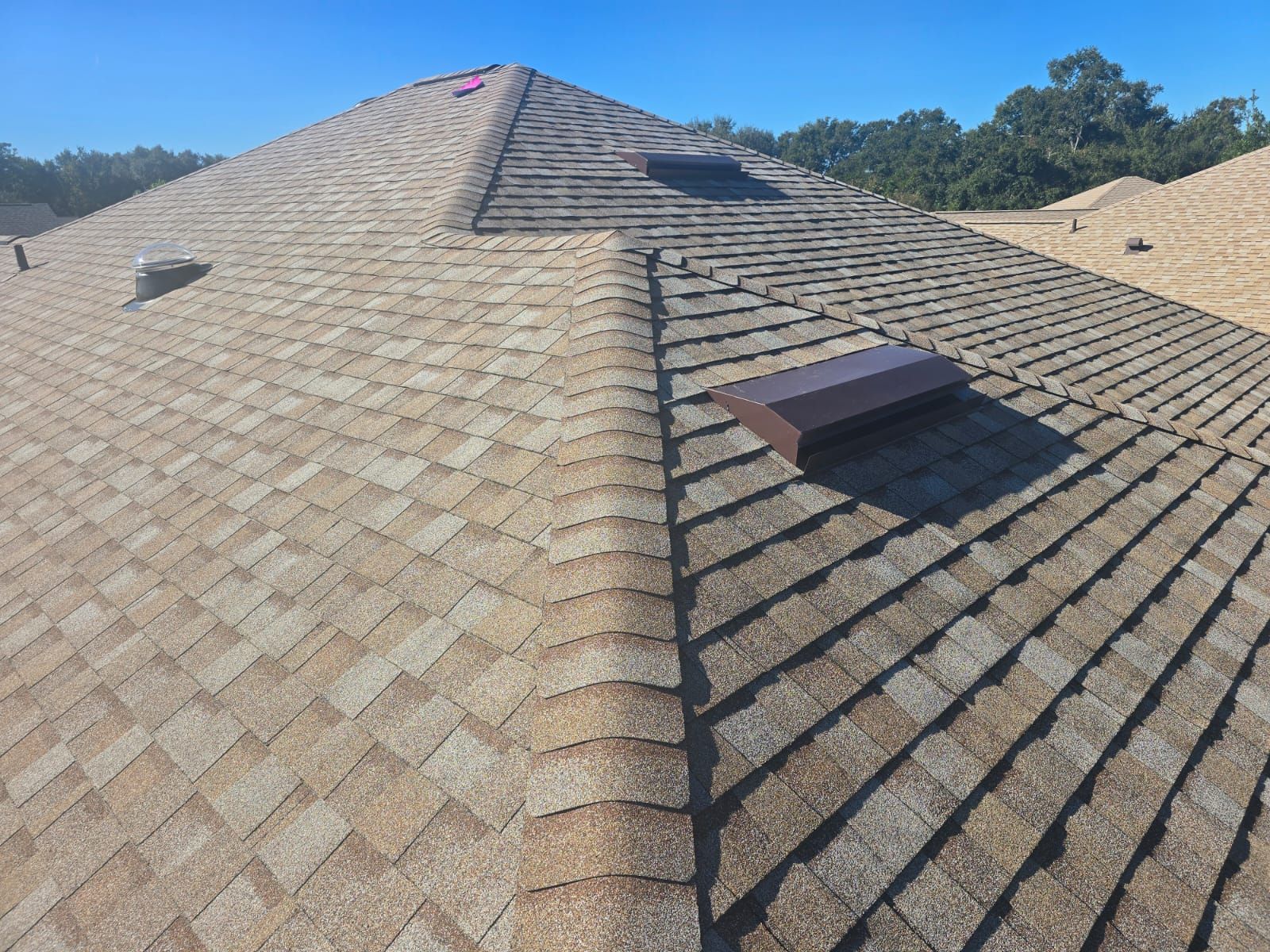 Shingle roof installation on a home in Kissimmee, FL, completed by local roofing contractors using high-performance shingles.