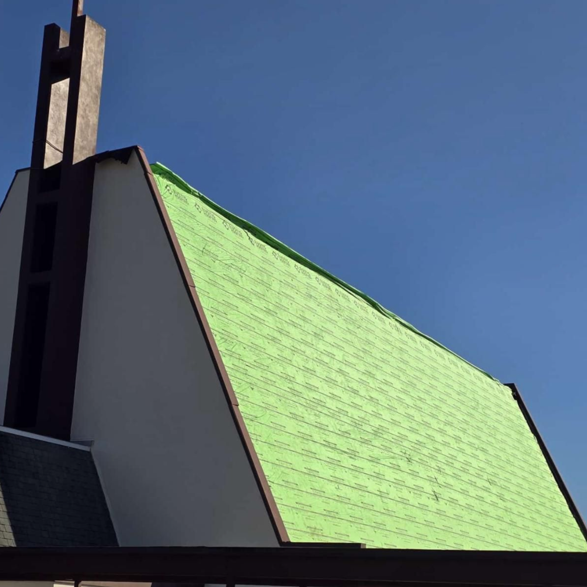 Church shingle roof in Florida with ridge replacement and green underlayment — roofing cost forecast example for large structures in 2026.