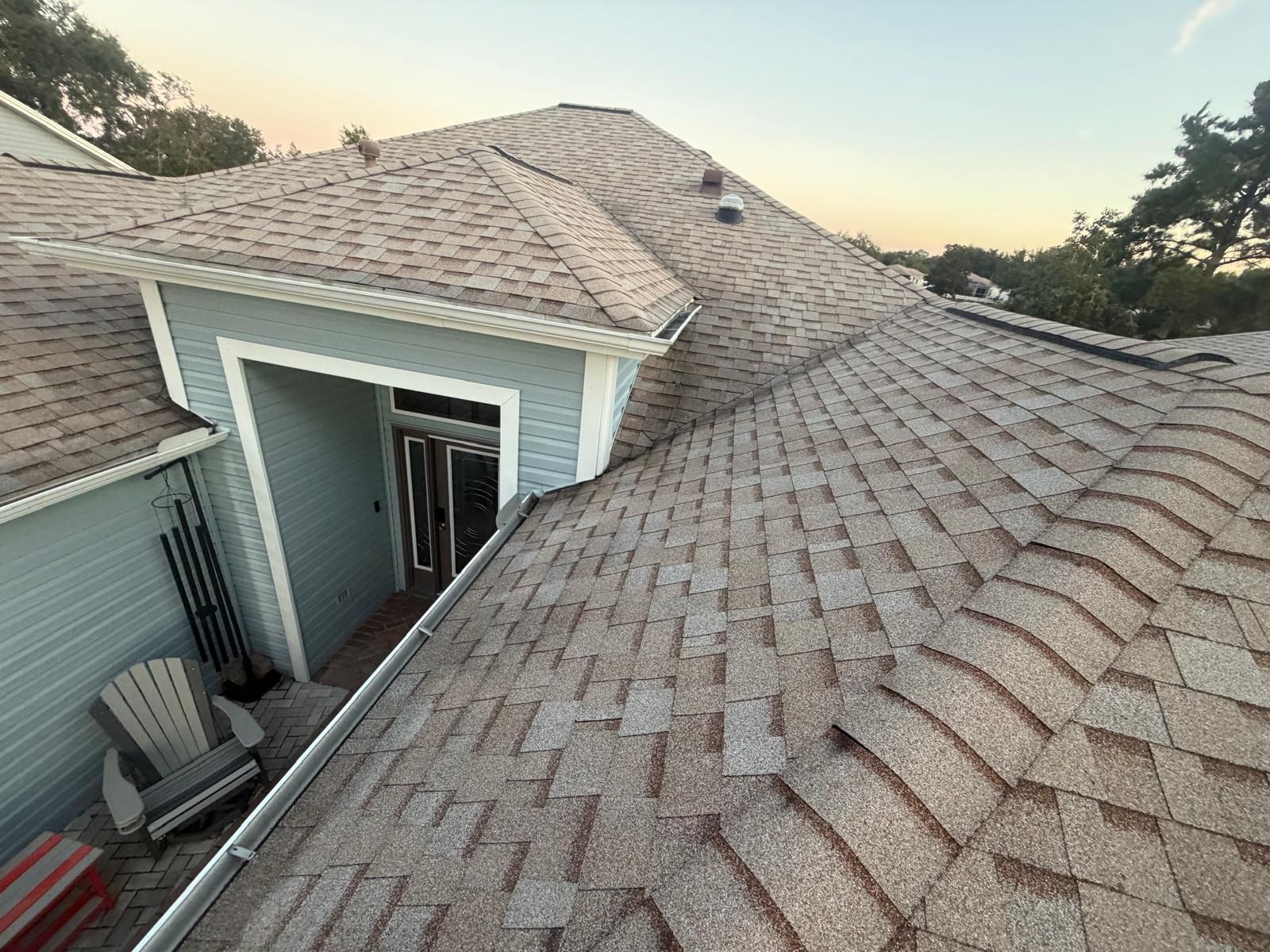 Residential shingle roof installation in Florida featuring new architectural shingles and proper flashing around the home’s exterior.