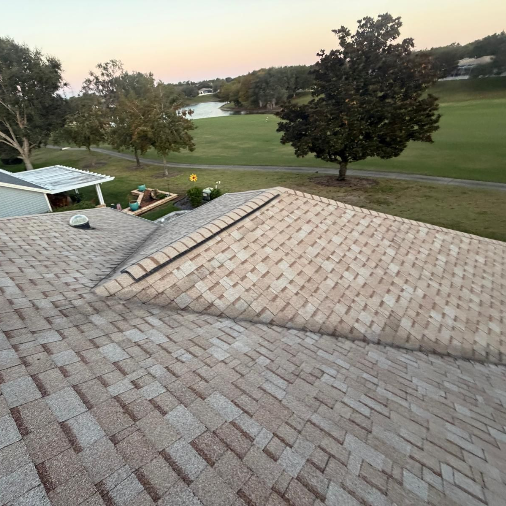 Residential shingle roof installation in Florida with new architectural shingles — roof replacement cost example for 2026 forecast.