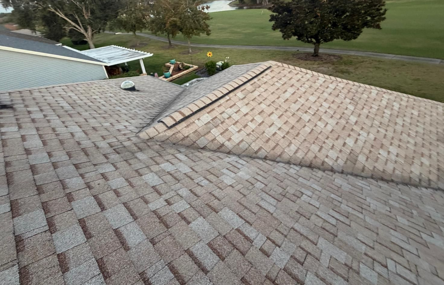 Close-up of a freshly installed architectural shingle roof on a Florida home in Orange County, showing clean lines and professional roofing work.