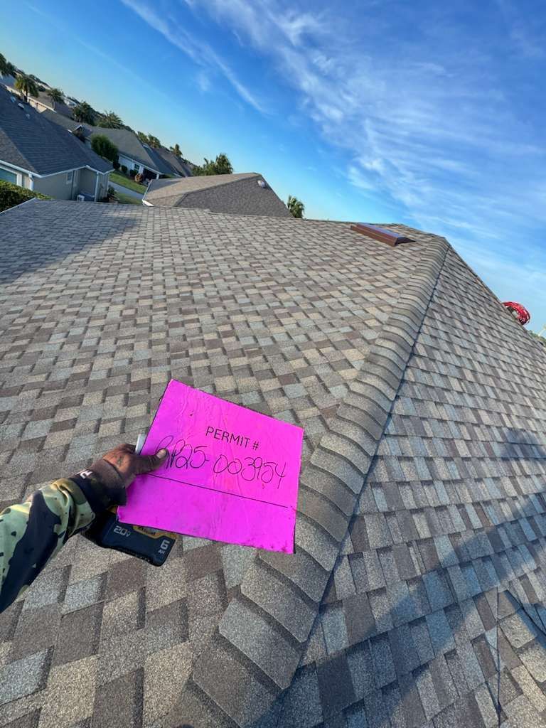 Florida shingle roofing project showing completed roof replacement with architectural shingles in a suburban neighborhood.