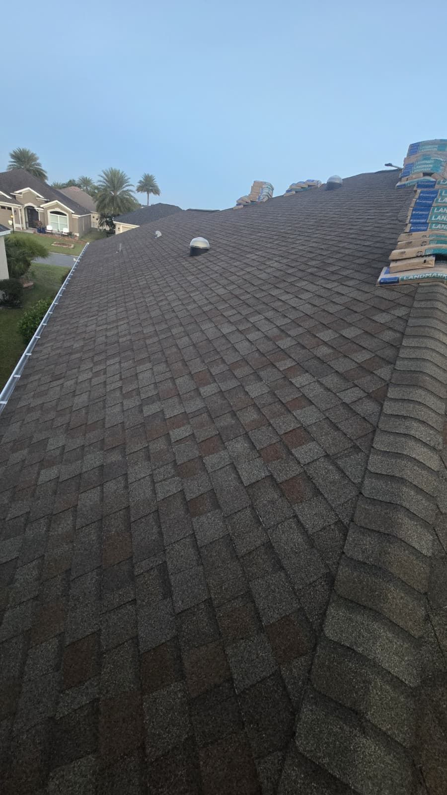 Shingle roof installation in Apopka FL — new architectural shingles being installed by local roofing contractors in a residential neighborhood.