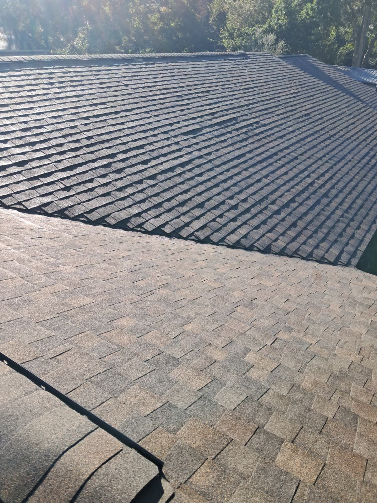 Newly installed asphalt shingle roof in Casselberry Florida with clean surface and precise alignment after full roof replacement.