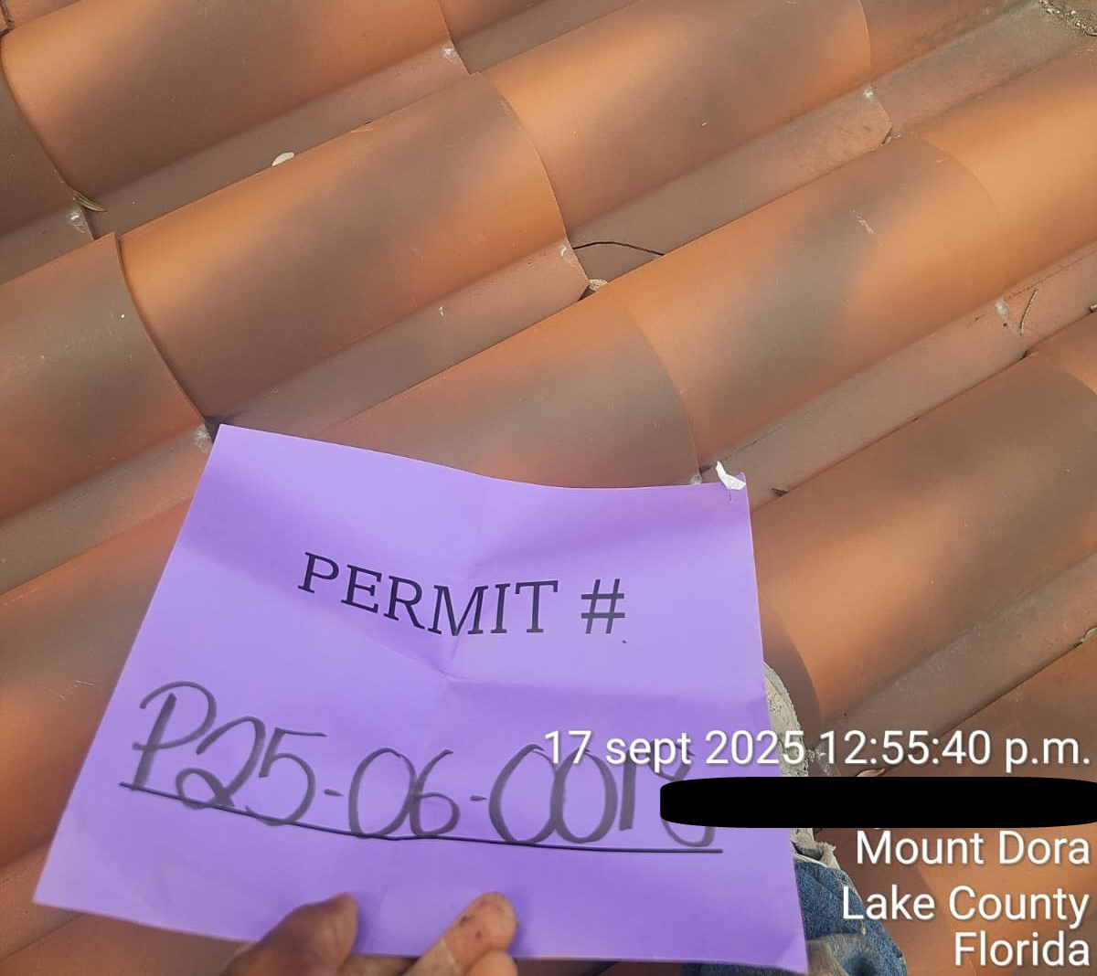 Roofing contractors repairing tile roof in Orlando, FL — professional tile replacement to fix storm damage.