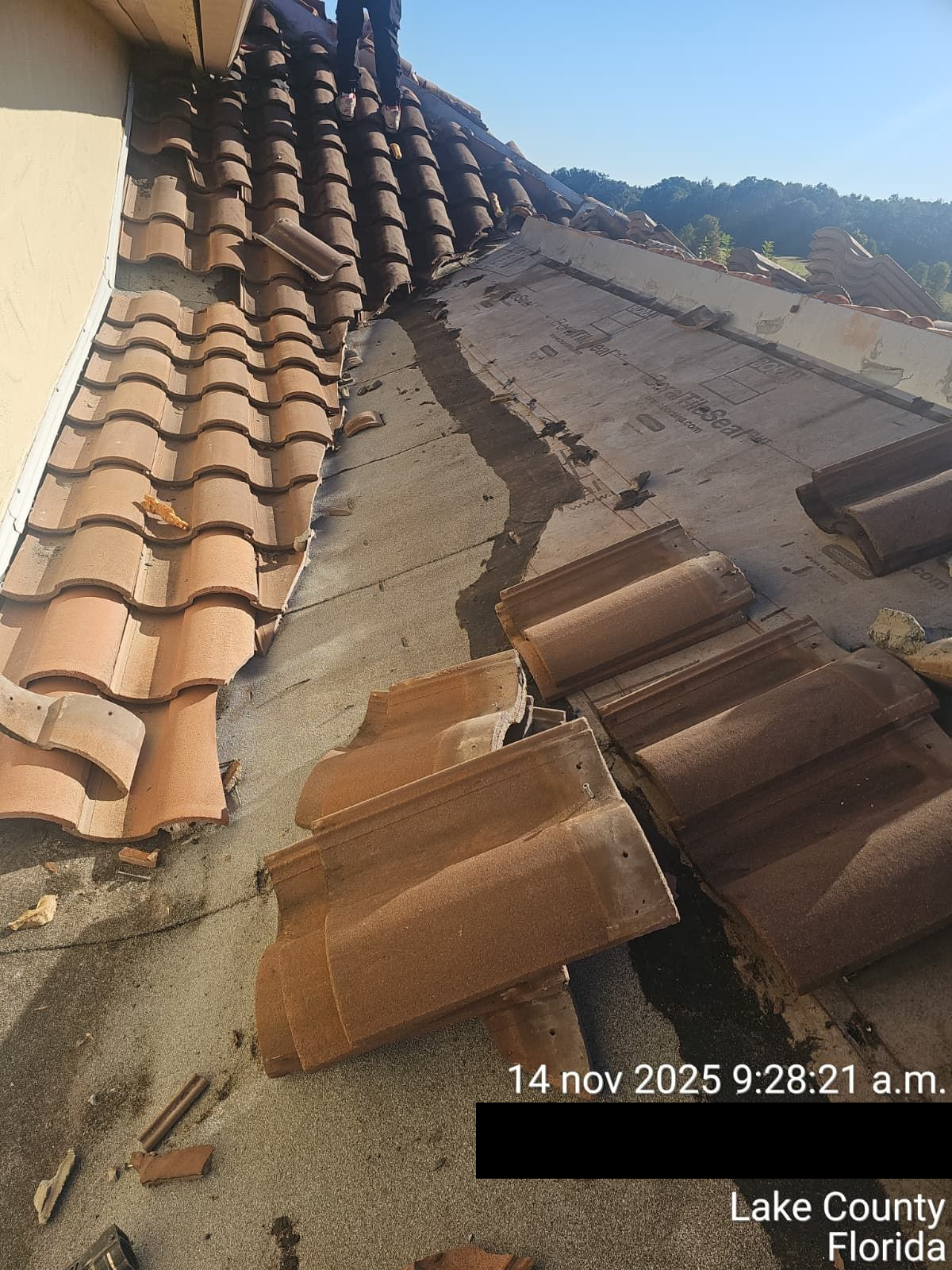 Roofing specialists repairing storm-damaged roofs in Bartow, Florida, using hurricane-rated materials and precision restoration techniques to protect historic and family homes from Central Florida weather.