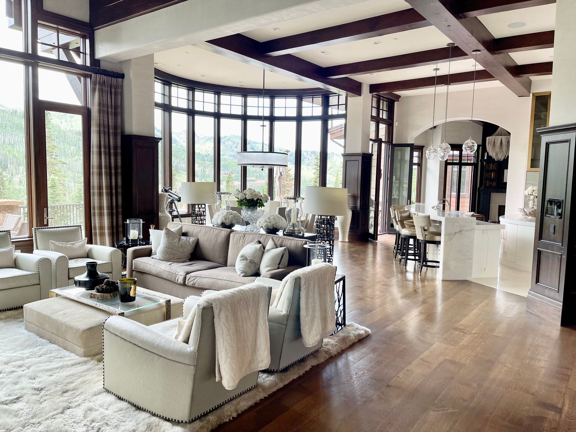A living room filled with furniture and a lot of windows.