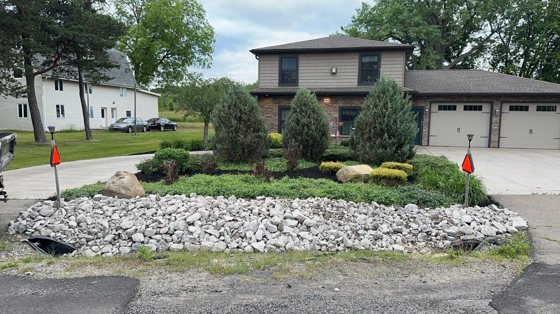 A house with a lot of rocks in front of it