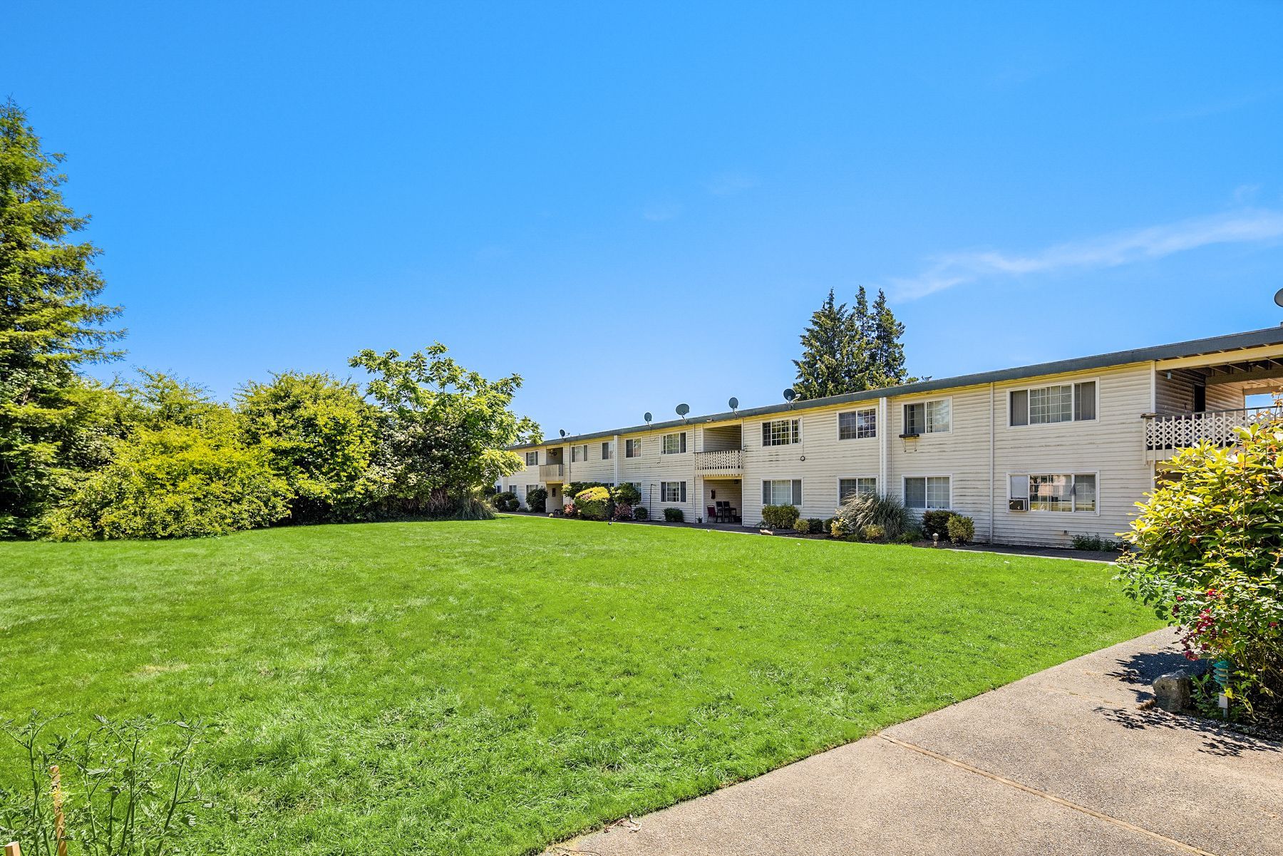 esquire exterior with lawn side view and walkway