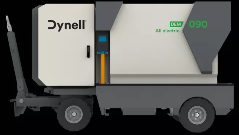 Ein weiß-grauer Lastwagen mit dem Wort „Dynell“ an der Seite.