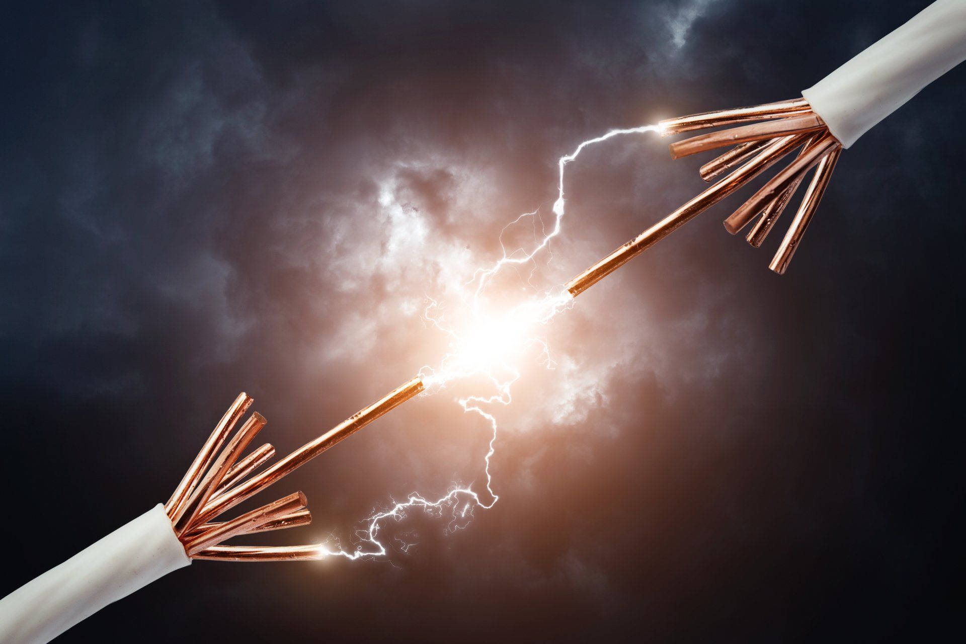 Two copper wires are connected to each other with lightning coming out of them.