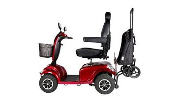 Side view of a red, four wheel electric scooter with shopping basket and shopping trolley attached