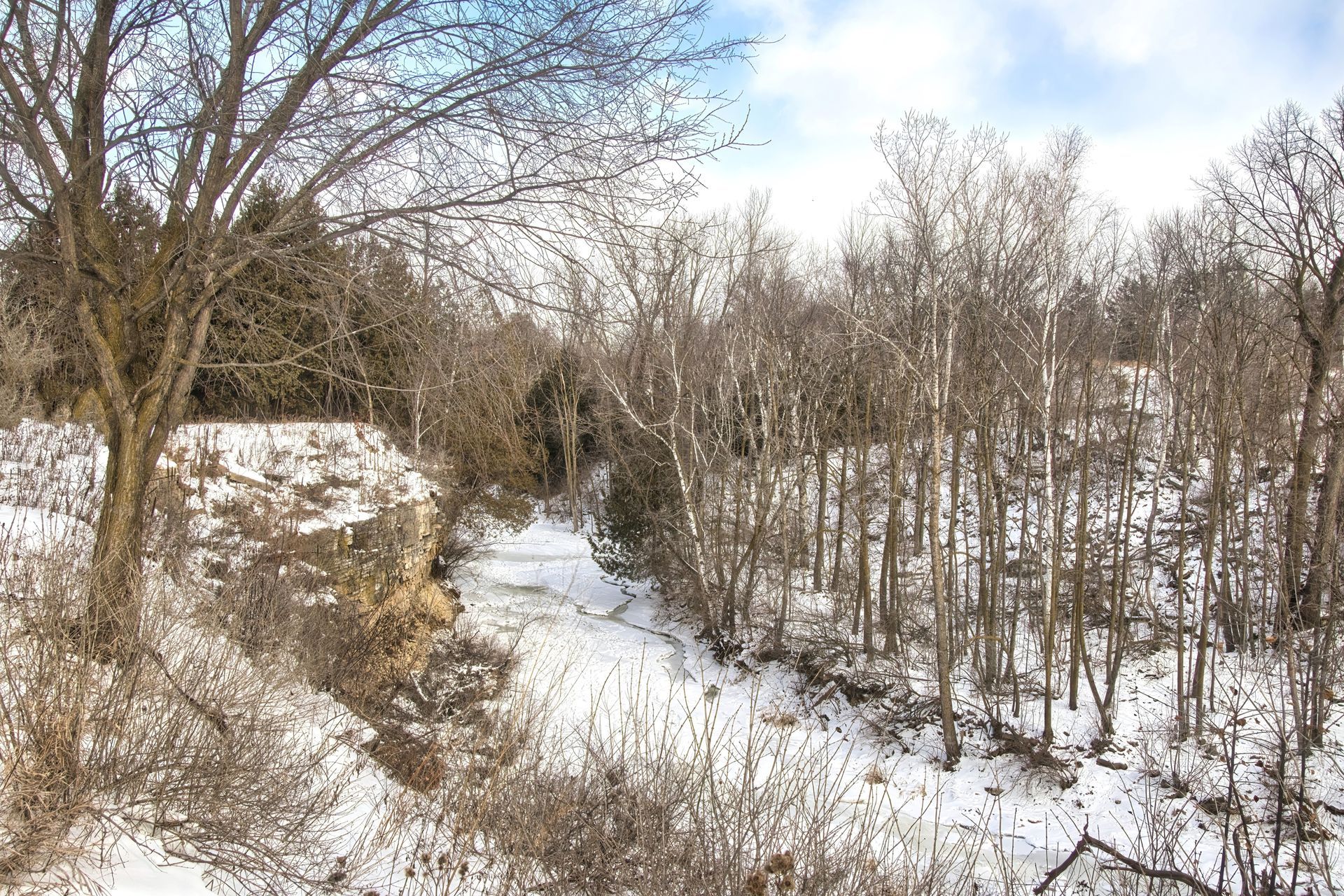 A sunset over a mountain range with a lot of fog