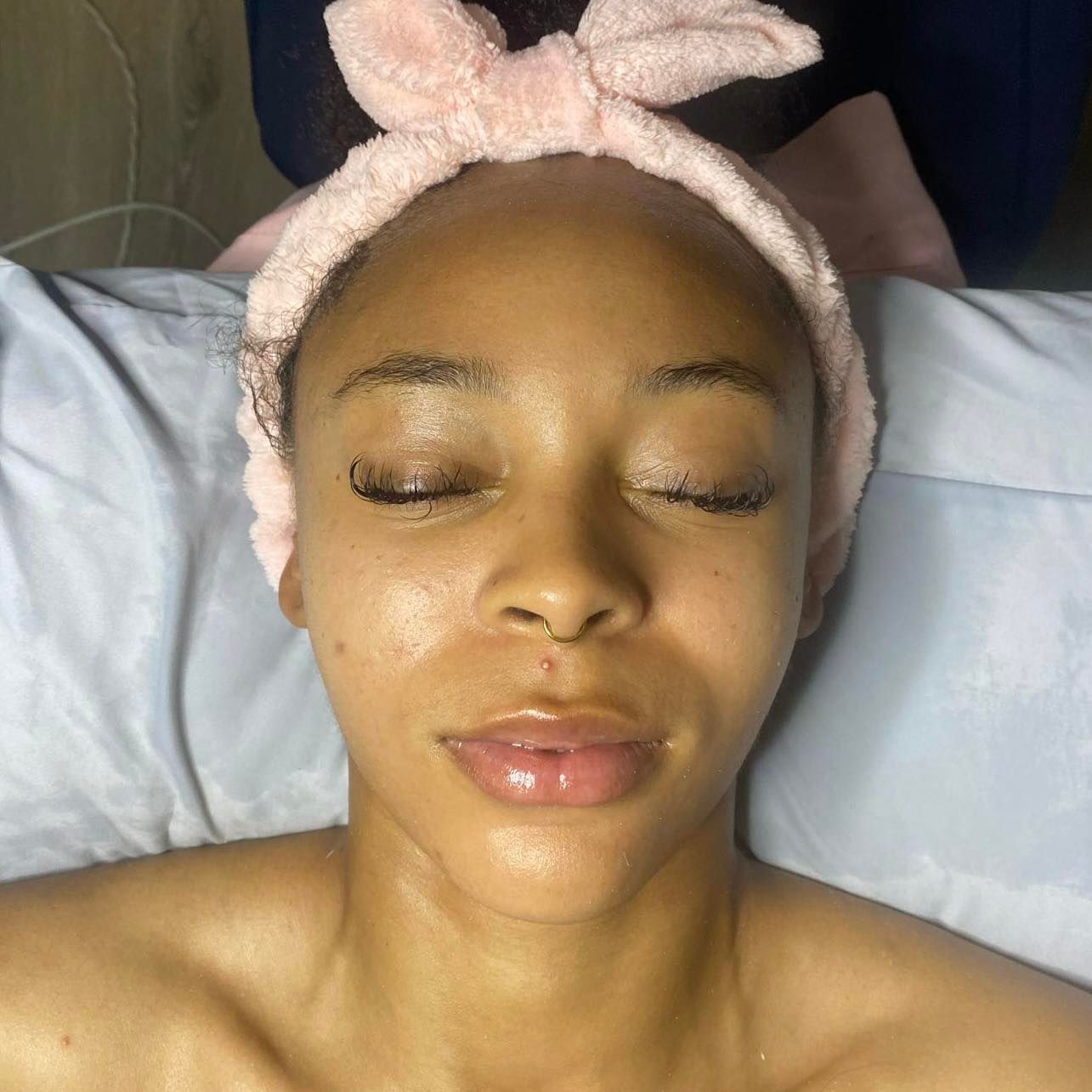 A close up of a person 's eye with the sun shining on it.