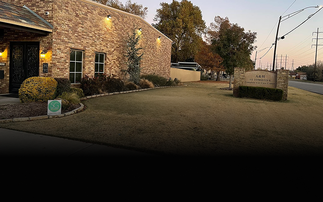 Brick building with windows and a sign that reads