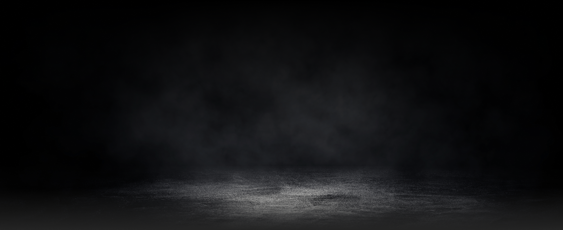 Dark, smoky background with a rough, textured floor  - A&H Automotive Repair Shop