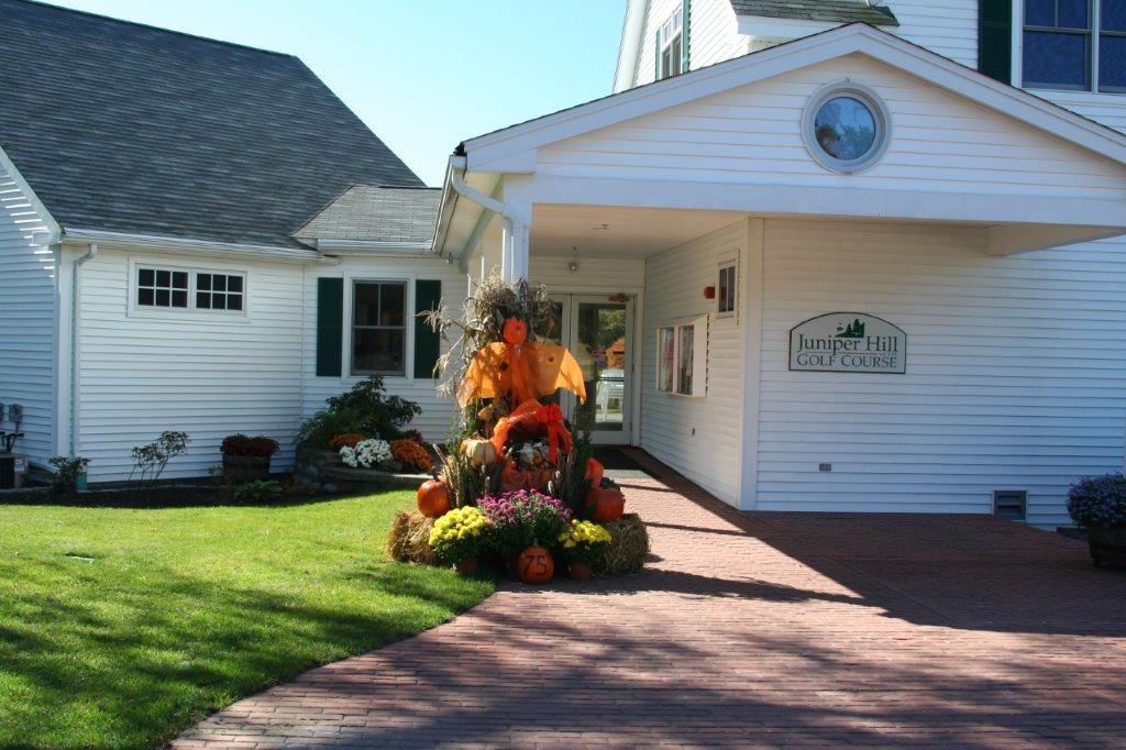 A white house with a sign on the front that says hampton