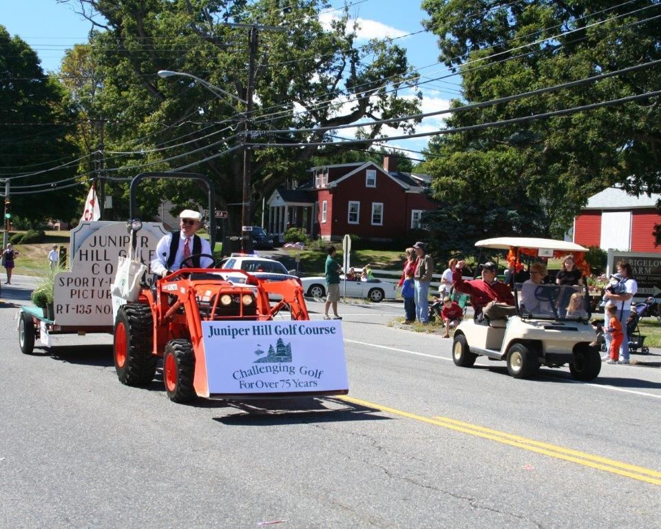 A tractor with a sign that says june hill on it