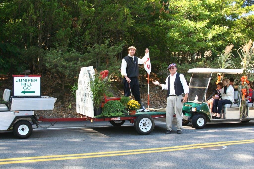 A golf cart with a sign that says campbell hill on it