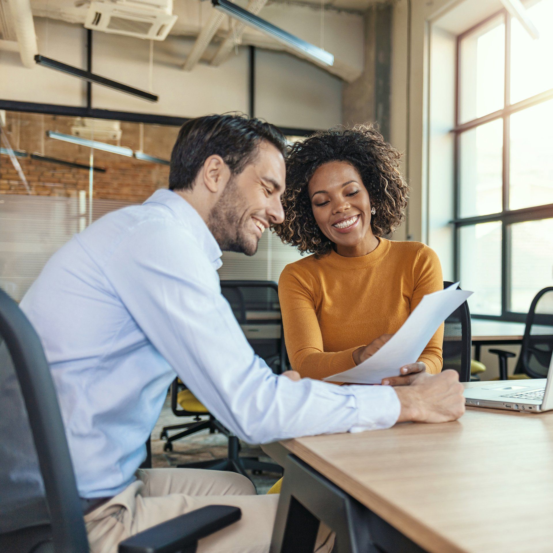 Young Businessmen Having a Successful Meeting - Nationwide - Quest Innovative Solutions, LLC