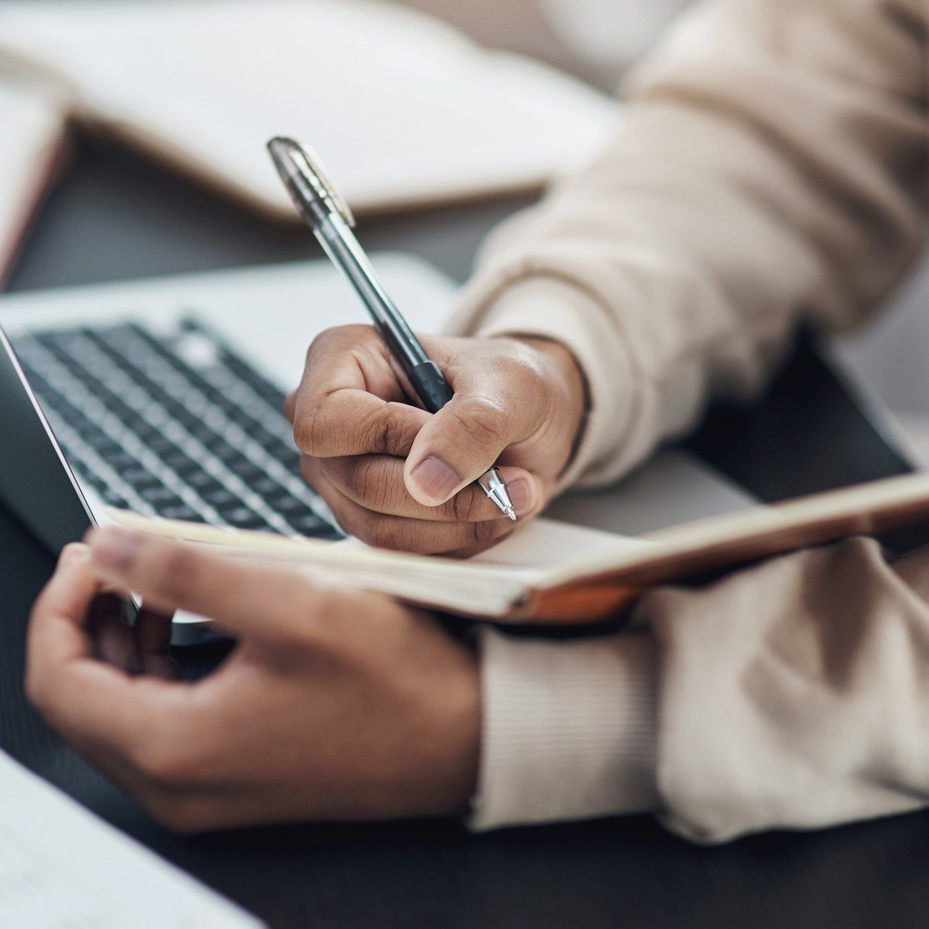 Man Writing in a Notebook - Nationwide - Quest Innovative Solutions, LLC