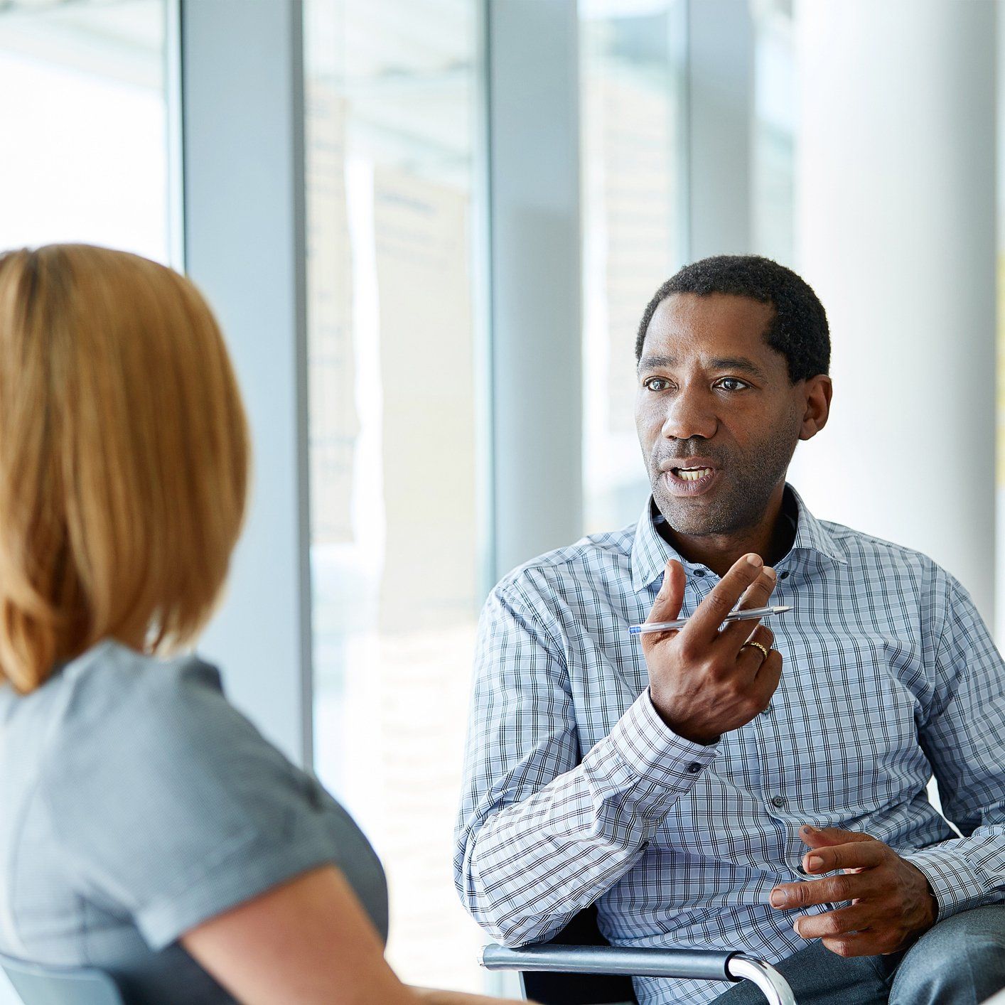 Two Colleagues Talking Together - Nationwide - Quest Innovative Solutions, LLC