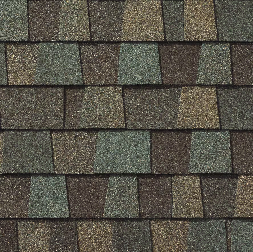 Close-up of a roof with overlapping asphalt shingles in various shades of brown, green, and tan.