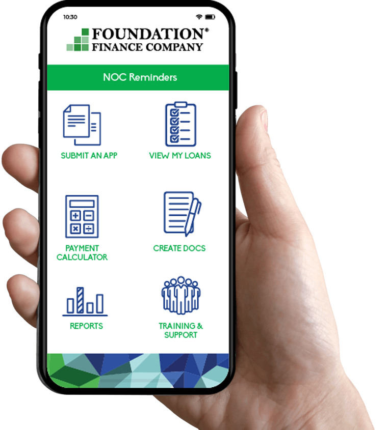 Hand holding a phone displaying the Foundation Finance Company app with options for loan management and support.