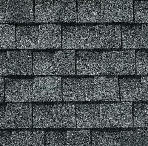 Dark gray asphalt roof shingles.