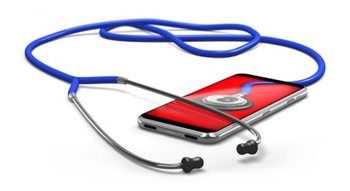 A stethoscope is sitting on top of a cell phone.