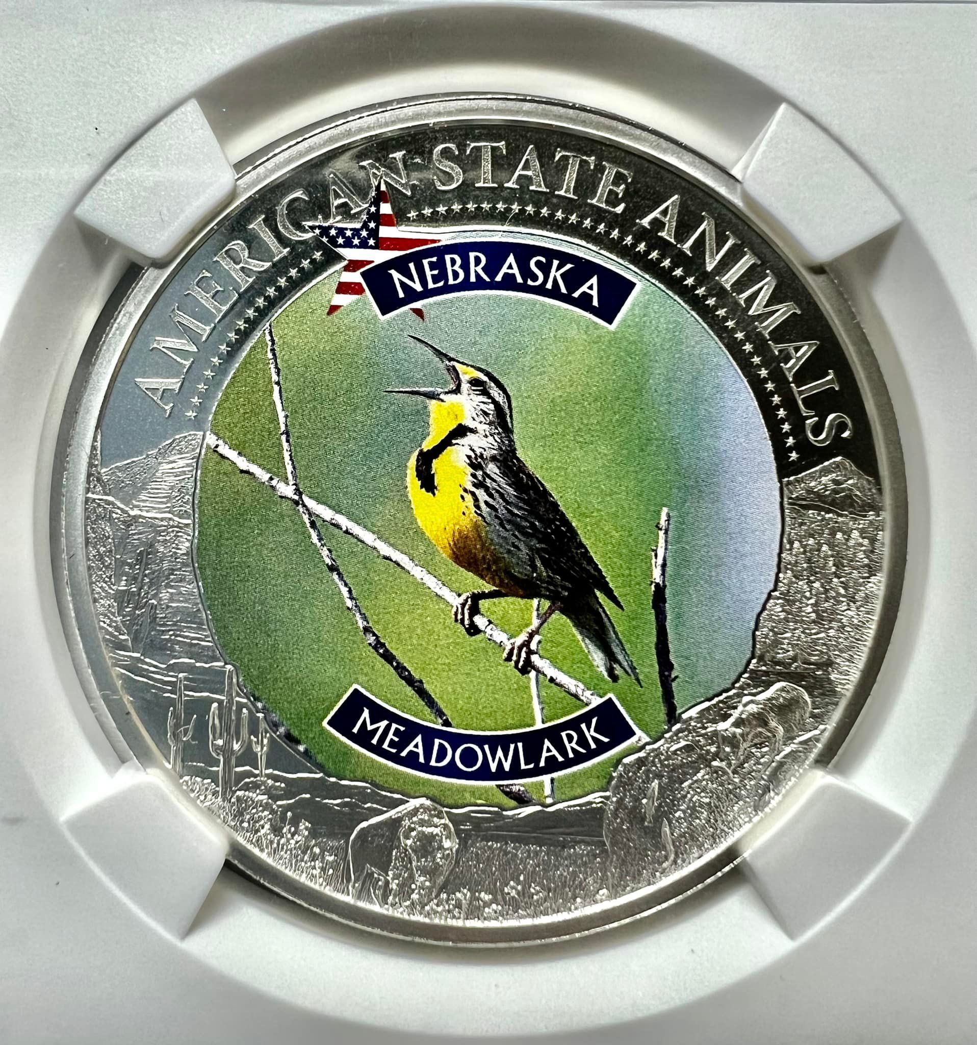 A commemorative coin showing a Western Meadowlark, Nebraska's state bird, with 