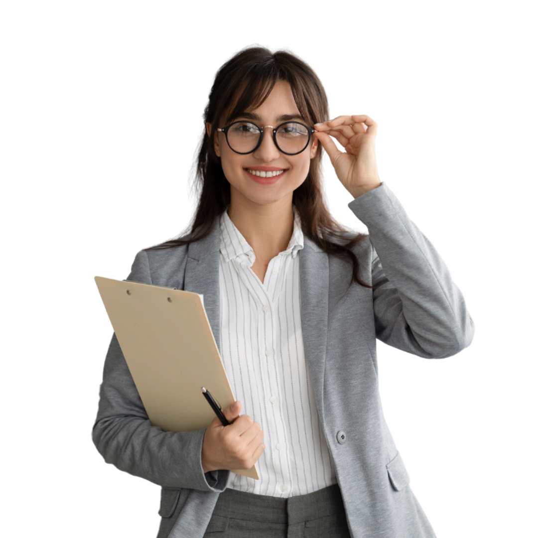 Woman in glasses and blazer, holding a clipboard, smiles while adjusting glasses.