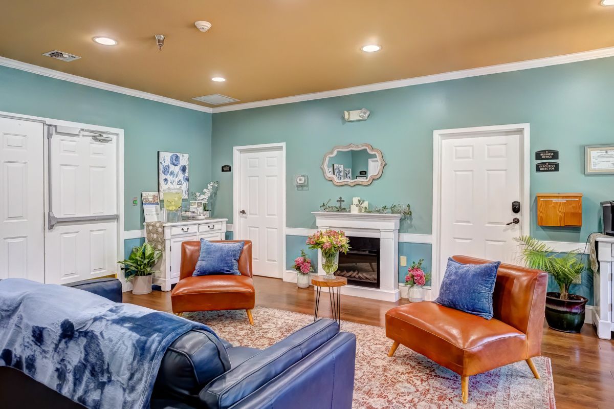 A living room filled with furniture and a fireplace.