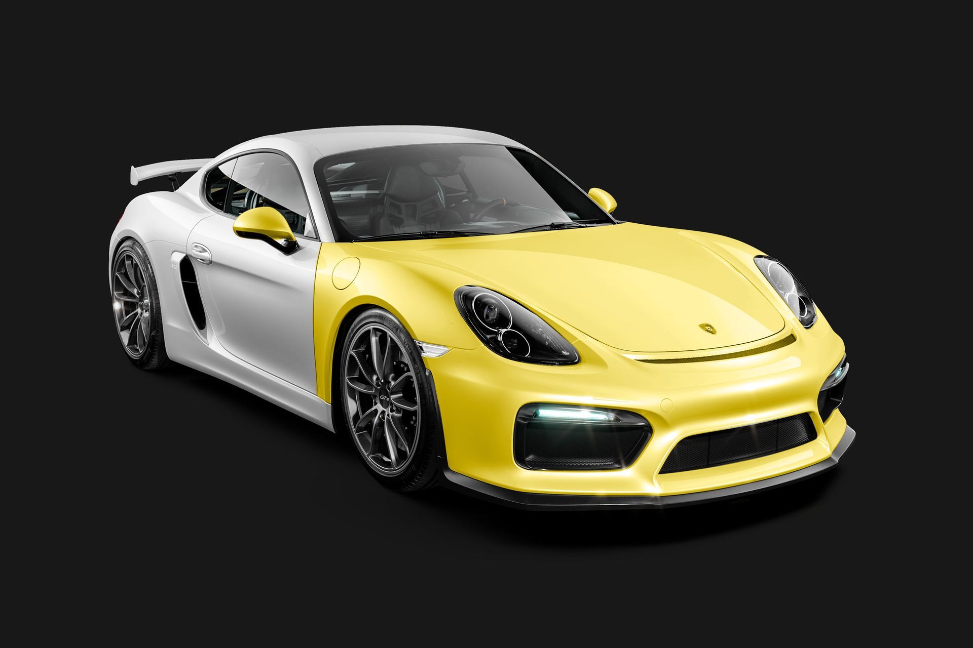 A yellow and white sports car on a black background.