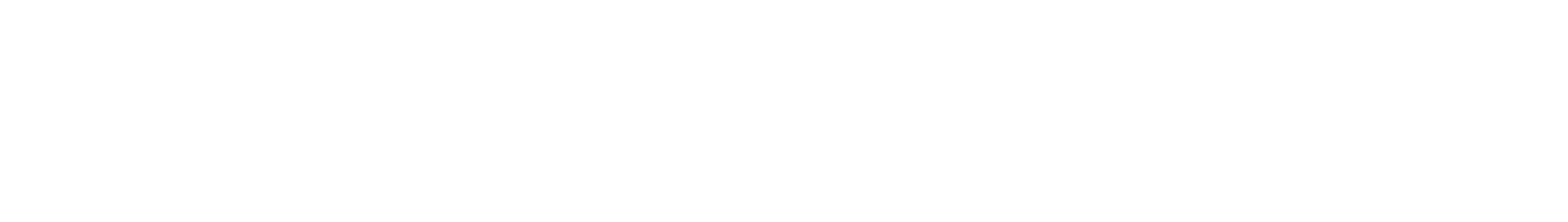 A white, minimalist, wall-mounted light fixture with a geometric, hexagonal shape.