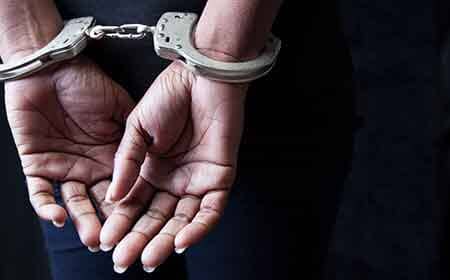 Drug Offenses — Handcuffed Criminal in Decatur, AL