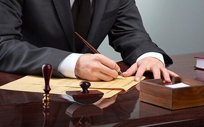Lawyer — Attorney Signing Papers in Decatur, AL