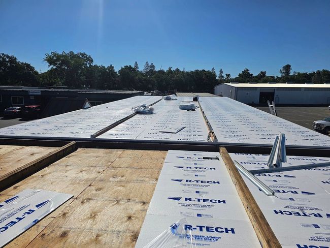 a roof is being covered with p-tech foam