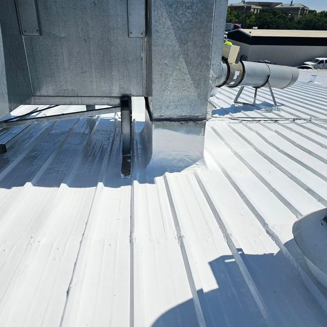 a close up of a white roof with a ventilation system on it