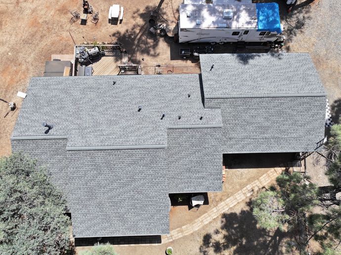 an aerial view of a large house with a tiled roof
