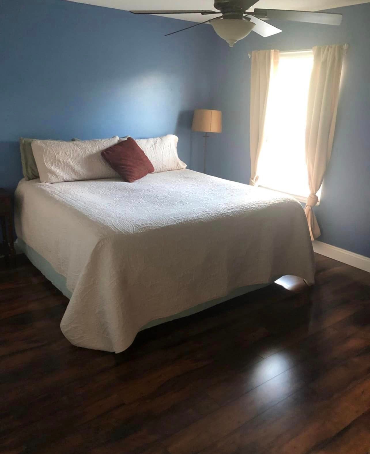 Tidy and sanitized bedroom maintained through recurring cleaning in New Port Richey homes