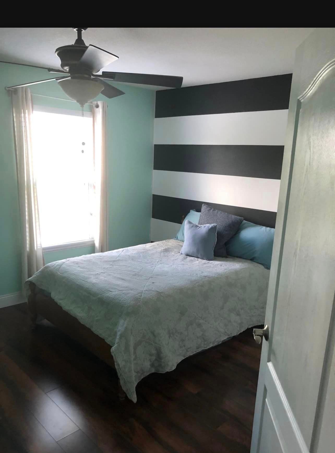 Professionally cleaned guest bedroom showing results of detailed house cleaning services