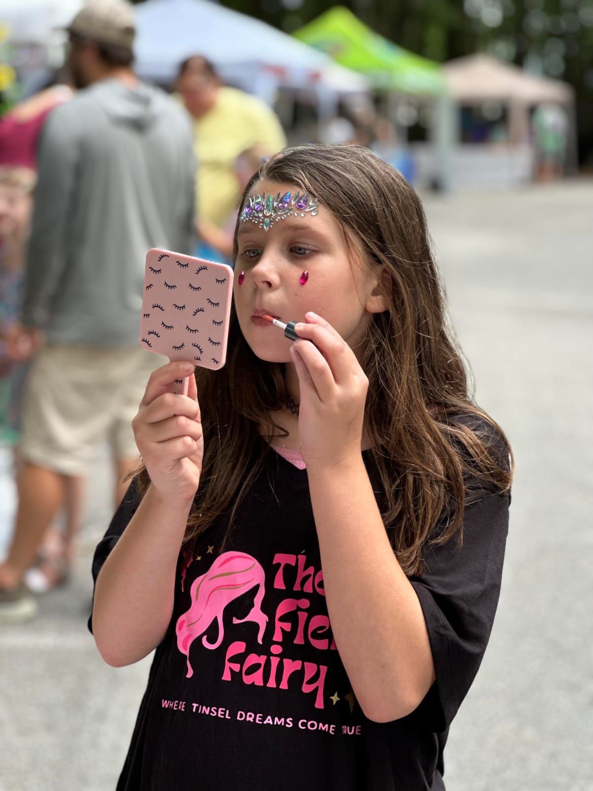 Young Lady Putting Lipstcik